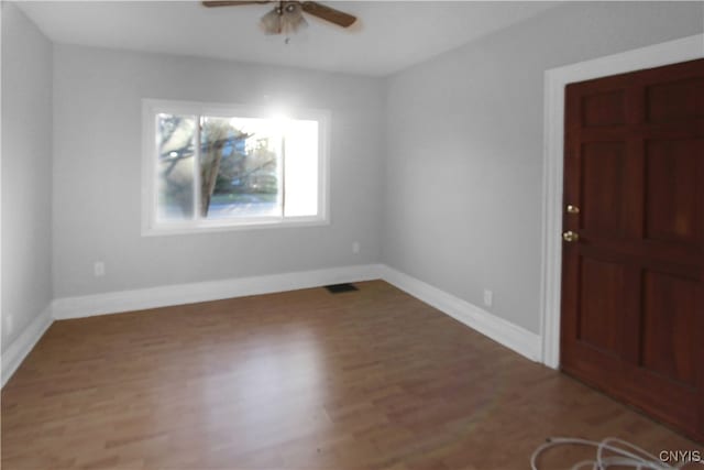 entryway featuring wood-type flooring and ceiling fan