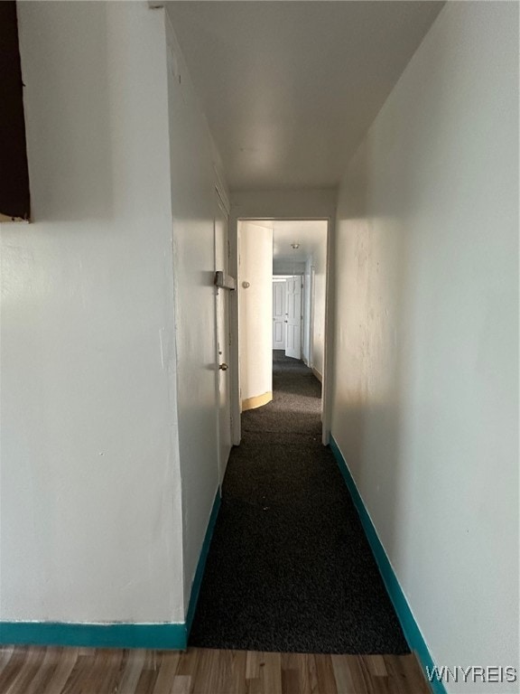 hallway featuring dark hardwood / wood-style floors