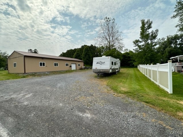 view of side of property with a yard