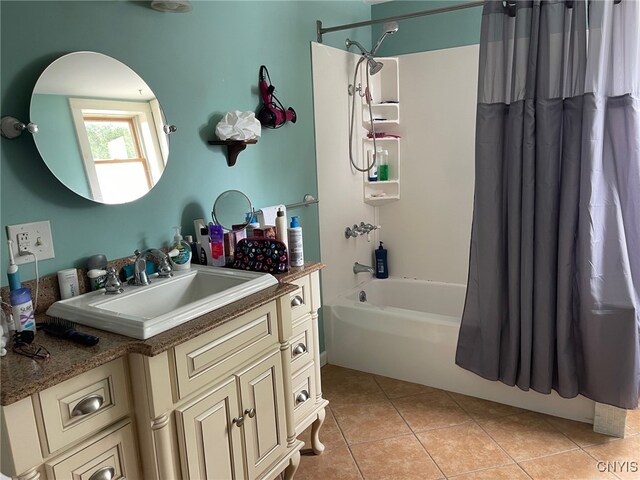 bathroom featuring vanity, shower / bath combination with curtain, and tile patterned floors