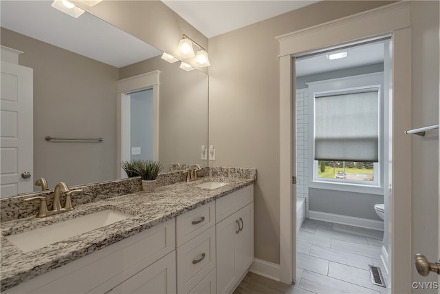 bathroom with vanity and toilet