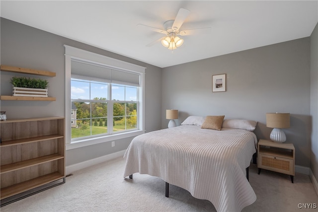 bedroom with ceiling fan and carpet