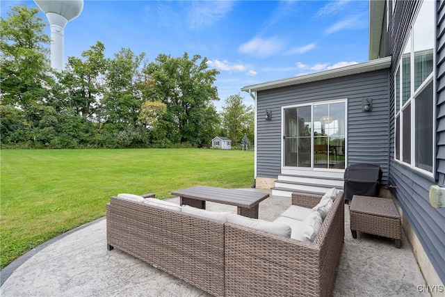 view of patio / terrace featuring outdoor lounge area, area for grilling, and a shed