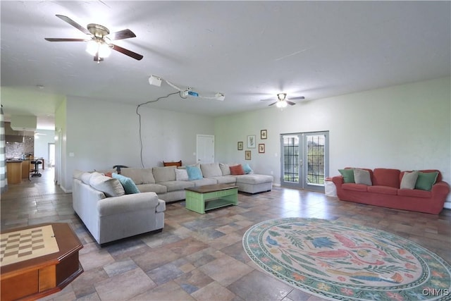 living room featuring ceiling fan and french doors