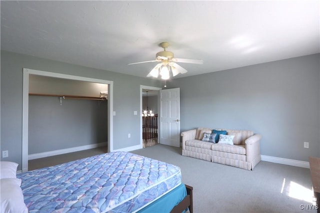 carpeted bedroom featuring ceiling fan and a closet