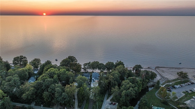 aerial view at dusk with a water view