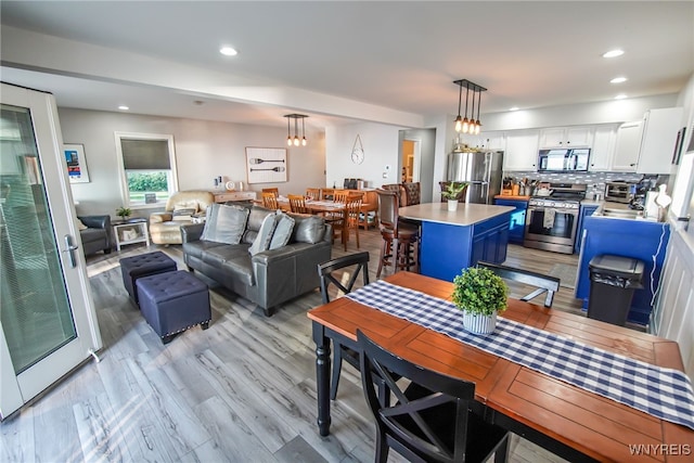 dining area with light wood-type flooring