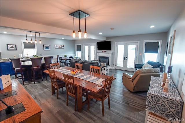 dining space featuring french doors and dark wood-type flooring