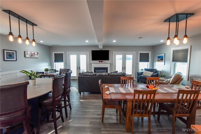 dining room featuring french doors and dark hardwood / wood-style flooring