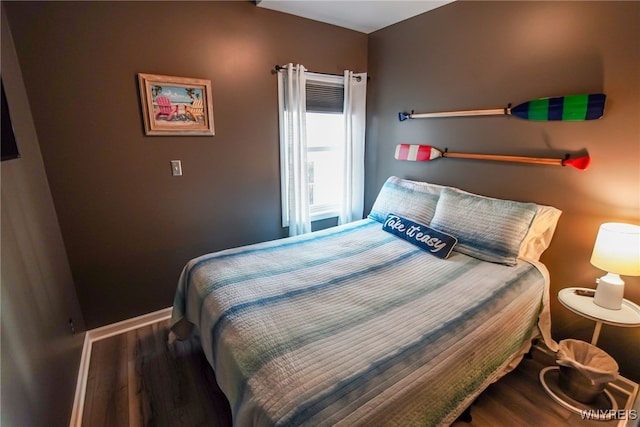 bedroom with wood-type flooring