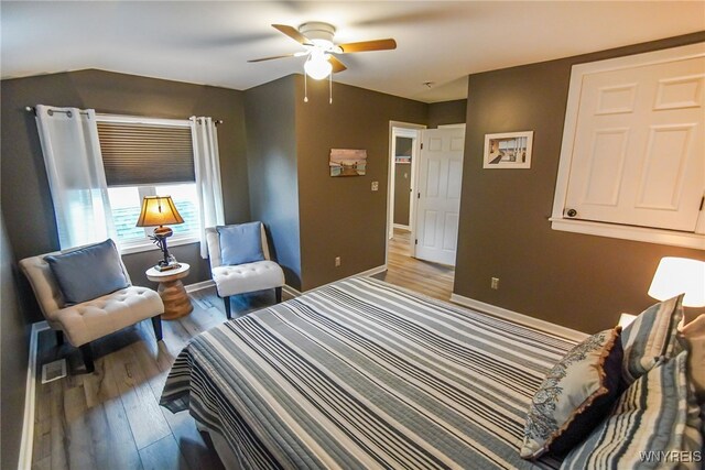 bedroom featuring ceiling fan and hardwood / wood-style flooring