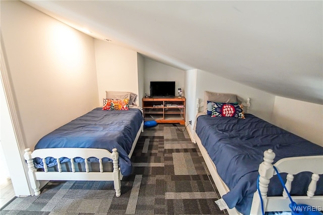 bedroom with lofted ceiling