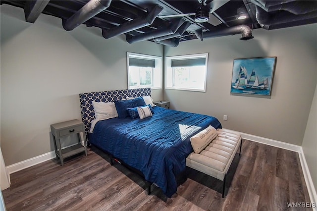 bedroom featuring ceiling fan and dark hardwood / wood-style flooring