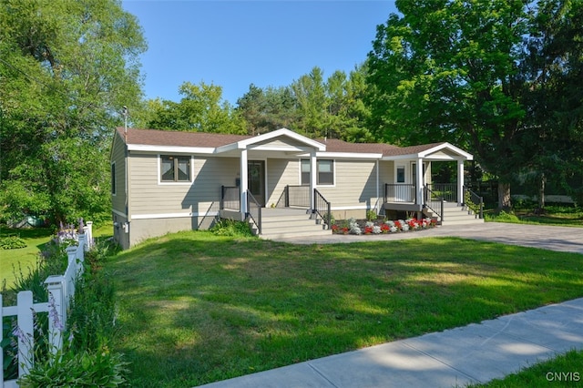 view of front of home with a porch and a front lawn