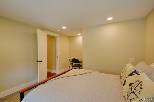 bedroom with hardwood / wood-style flooring