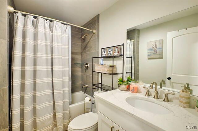 full bathroom featuring vanity, toilet, and shower / bath combo with shower curtain