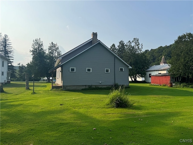 view of property exterior with a lawn