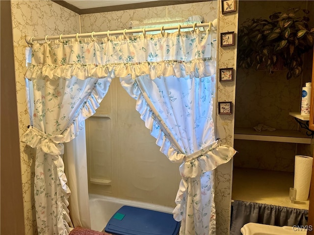 bathroom with a shower with curtain and crown molding