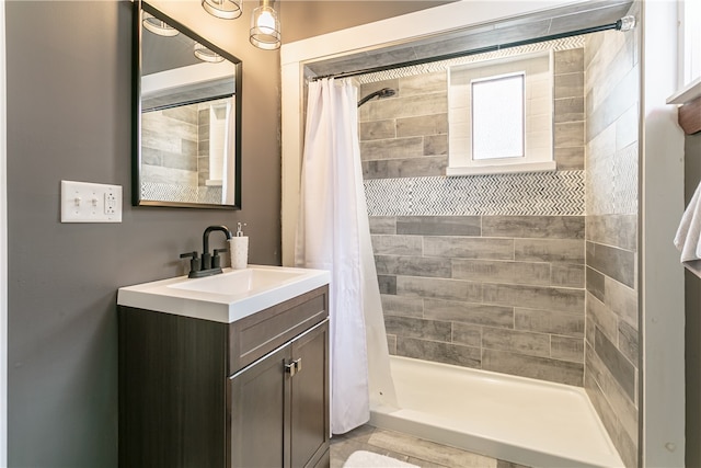 bathroom featuring a shower with curtain and vanity