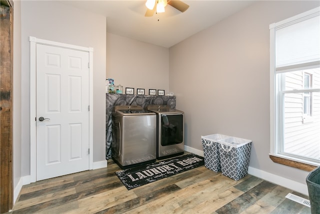 laundry room featuring washing machine and clothes dryer, ceiling fan, and dark hardwood / wood-style floors