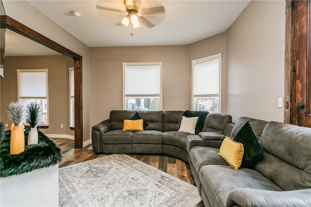 living room featuring ceiling fan and hardwood / wood-style floors