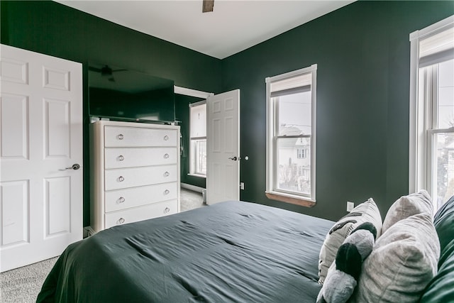 carpeted bedroom featuring ceiling fan