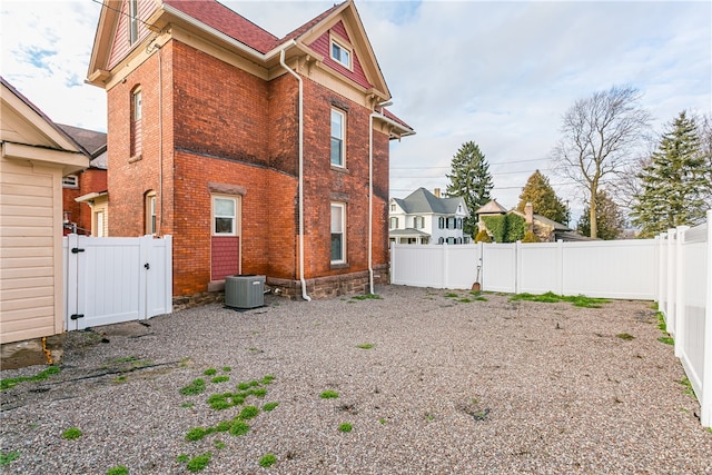 rear view of property featuring cooling unit