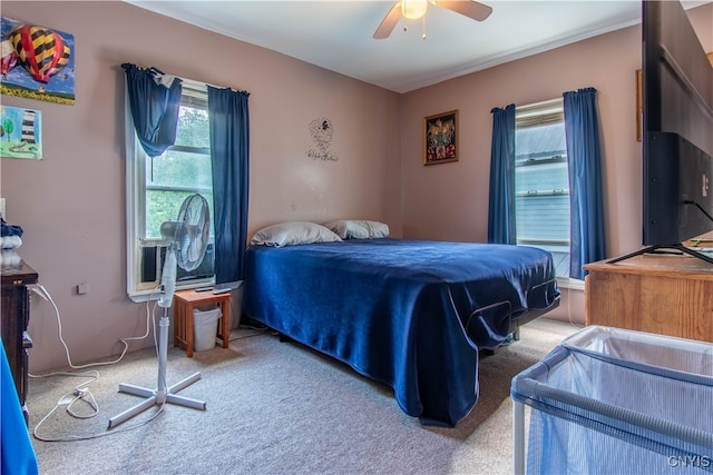 carpeted bedroom featuring ceiling fan