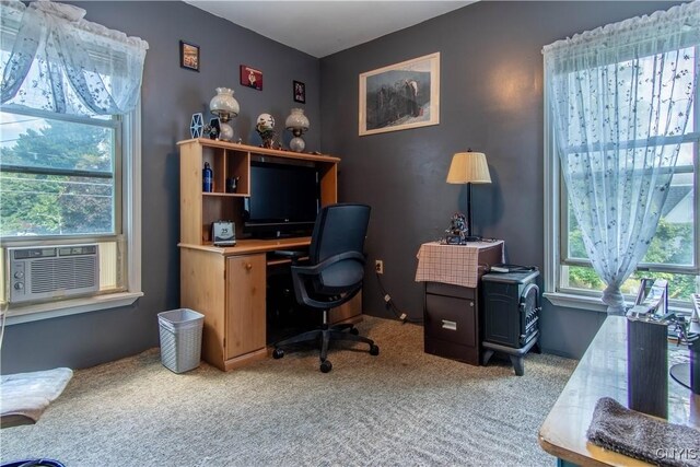 carpeted home office featuring cooling unit and a healthy amount of sunlight