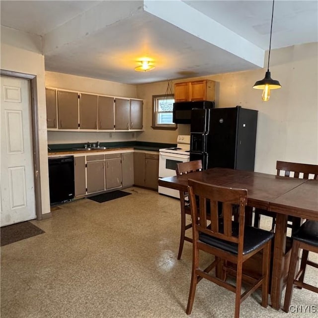 kitchen featuring pendant lighting, sink, and black appliances