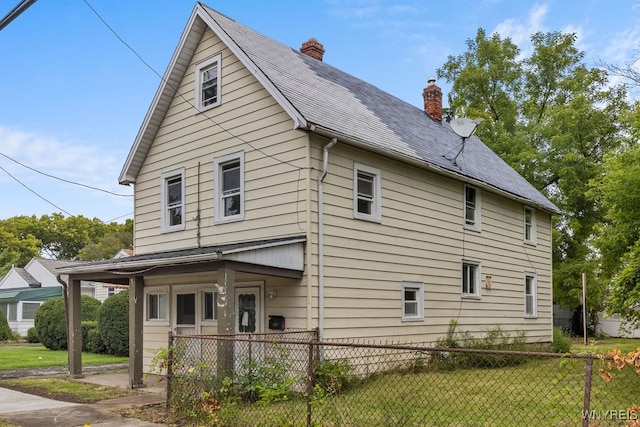 exterior space featuring a yard and covered porch