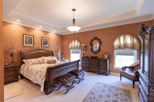 bedroom featuring carpet, a raised ceiling, and crown molding