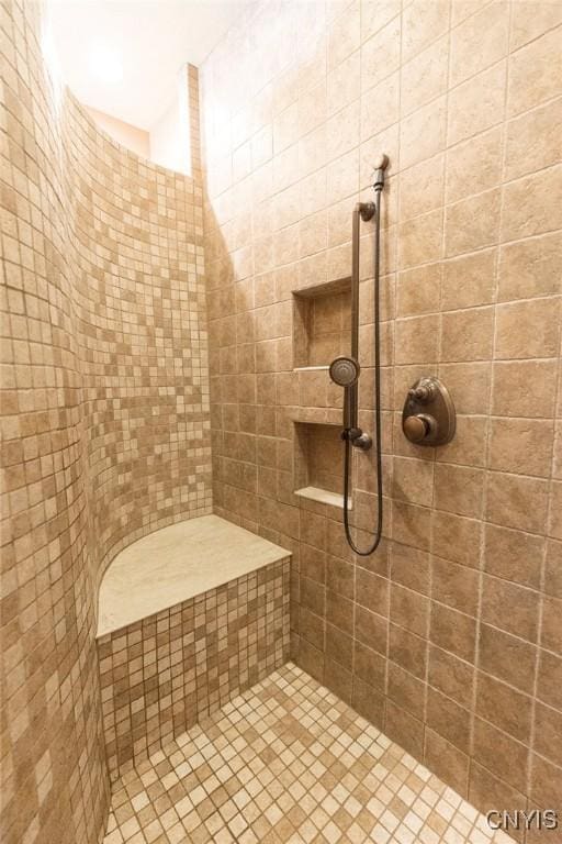 bathroom featuring tiled shower