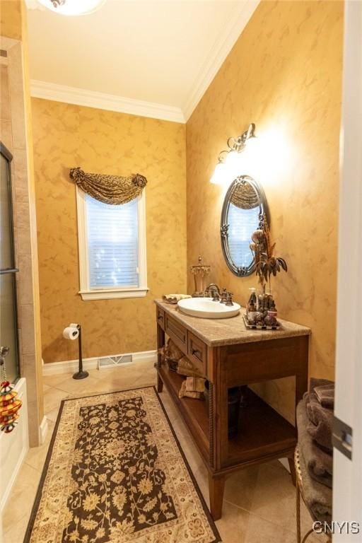 bathroom with tile patterned flooring, vanity, and ornamental molding