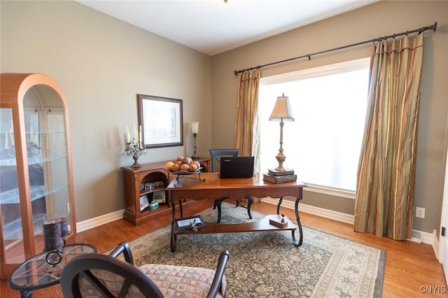 office with light hardwood / wood-style floors