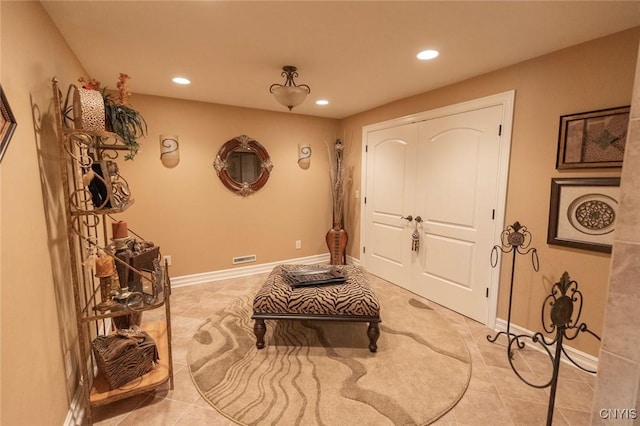 foyer featuring light tile patterned flooring