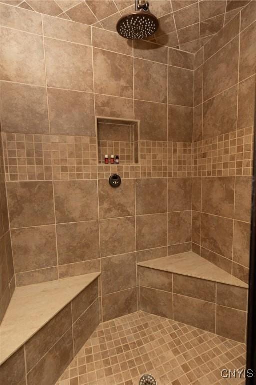 bathroom featuring tiled shower