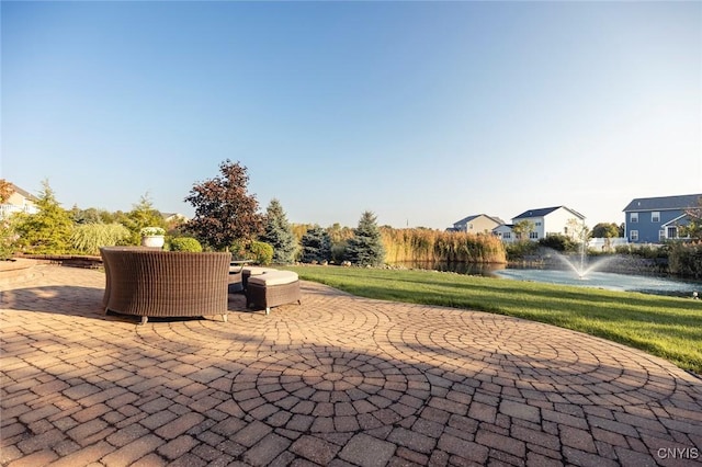 view of patio featuring a water view