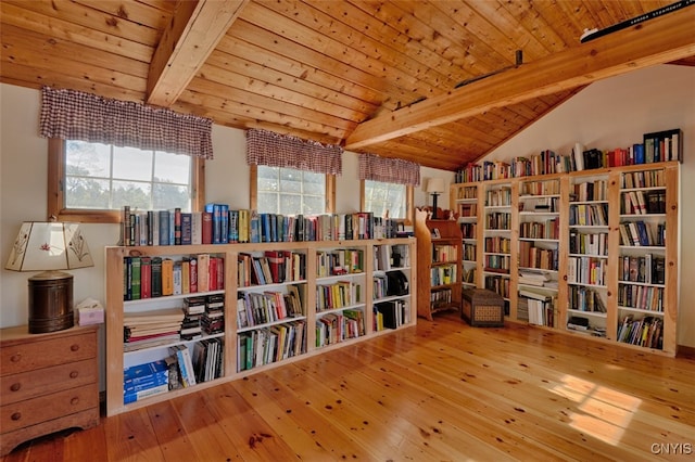 living area featuring vaulted ceiling with beams, hardwood / wood-style flooring, and wood ceiling