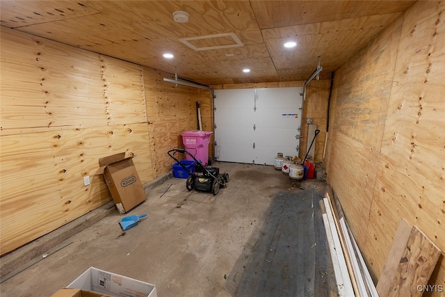 garage featuring wooden walls