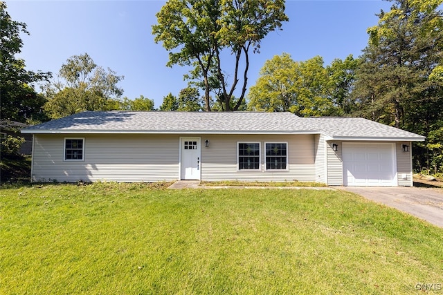 single story home featuring a front yard and a garage