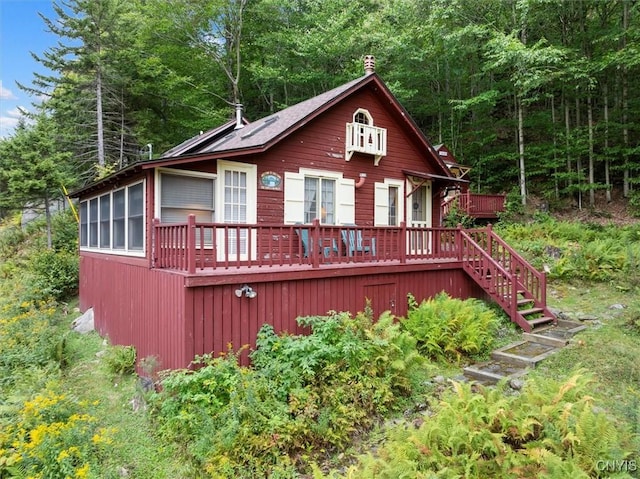 3544 State Route 28, Webb, NY 13420 - view of front of house with a wooden deck and stairs