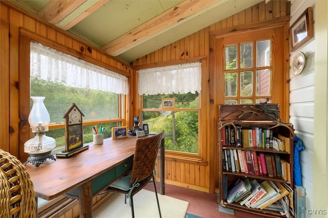 sunroom / solarium featuring lofted ceiling with beams and plenty of natural light