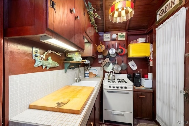 3544 State Route 28, Webb, NY 13420 - kitchen featuring white range with gas stovetop, light countertops, wooden ceiling, a sink, and open shelves
