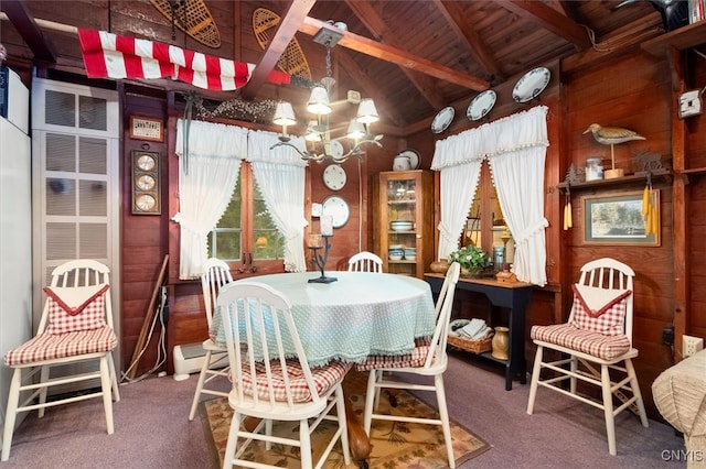 dining area featuring wood ceiling, lofted ceiling with beams, carpet floors, wood walls, and an inviting chandelier