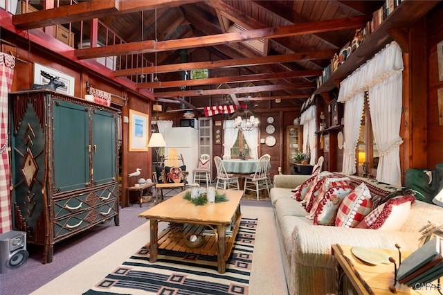 living room featuring carpet floors, wood walls, wood ceiling, and lofted ceiling with beams