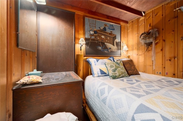 bedroom featuring wood walls and wooden ceiling