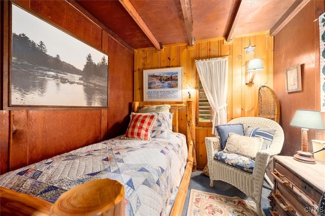 bedroom with wooden ceiling, beam ceiling, and wooden walls