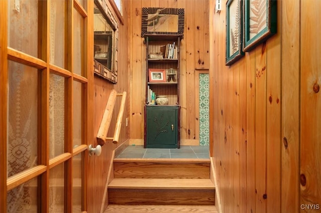 3544 State Route 28, Webb, NY 13420 - staircase featuring wooden walls and tile patterned flooring