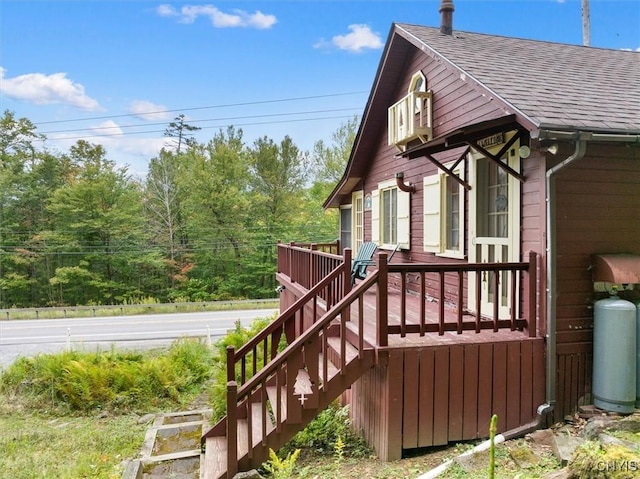 3544 State Route 28, Webb, NY 13420 - view of property exterior featuring roof with shingles, a deck, and stairs